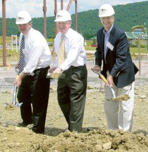 Lee Eichelberger, Tom Shaughnessy, and Jim Ryan Posing with Shovels At Groundbreaking Ceremony
