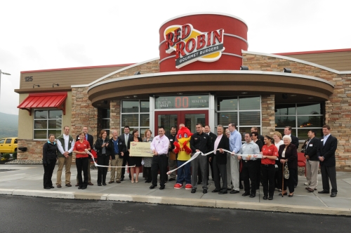 Red Robin Tilden Township Employees and Red Robin Mascot Red at Ribbon Cutting Ceremony, standing outside in front of the building