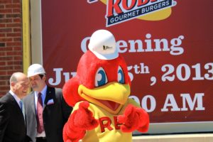 Collegeville Groundbreaking Ceremony Red Robin Mascot Red outside the building, two Lobar associates standing in background