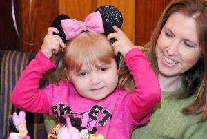 Leah Poleshuk tries on a pair of Minnie Mouse ears at the Hershey Red Robin