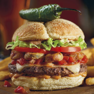 Red Robin Burnin Love Burger with jalapeno spear on top of the top bun